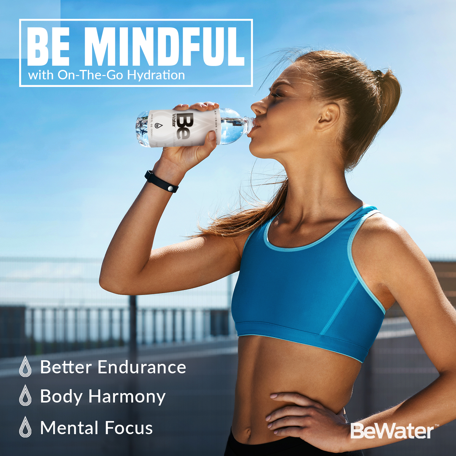 Woman in athletic wear drinking Be Water